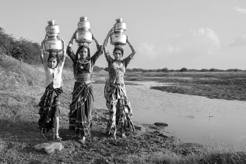 Human Right to Water in Kutch district, Gujarat - En route home with loads of filled-in pots